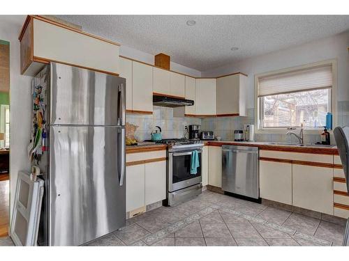161 Coyote Way, Canmore, AB - Indoor Photo Showing Kitchen With Double Sink