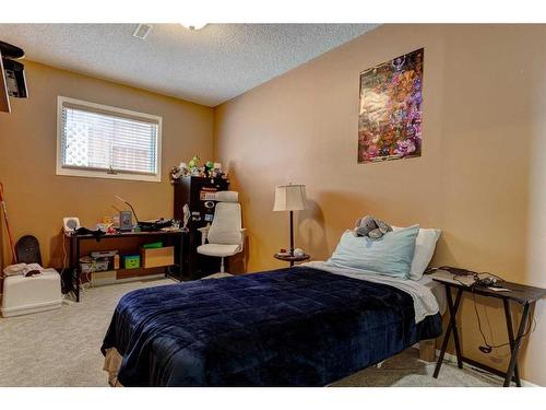 161 Coyote Way, Canmore, AB - Indoor Photo Showing Bedroom