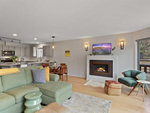 7-717 7Th Street, Canmore, AB - Indoor Photo Showing Living Room With Fireplace