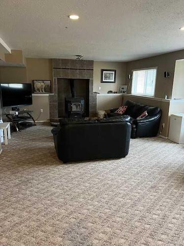 28 Graham Road, Whitecourt, AB - Indoor Photo Showing Living Room With Fireplace