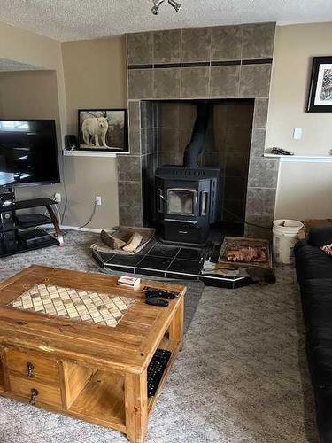 28 Graham Road, Whitecourt, AB - Indoor With Fireplace