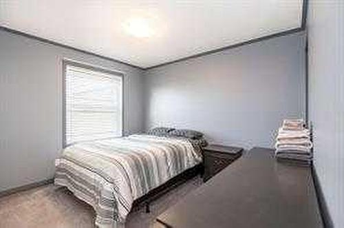 303-502 1 St, Fox Creek, AB - Indoor Photo Showing Bedroom