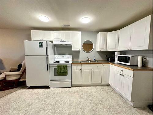 15 Chaisson Crossing, Whitecourt, AB - Indoor Photo Showing Kitchen With Double Sink