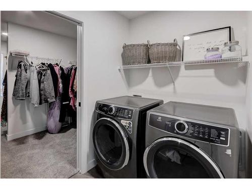 132 Precedence Hill, Cochrane, AB - Indoor Photo Showing Laundry Room