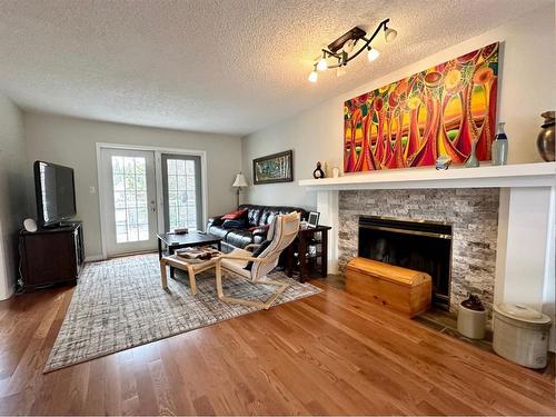 4 Ravine Drive, Whitecourt, AB - Indoor Photo Showing Living Room With Fireplace
