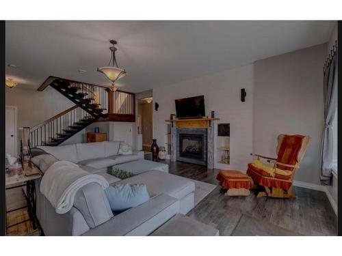 593068 Range Road 124, Rural Woodlands County, AB - Indoor Photo Showing Living Room With Fireplace