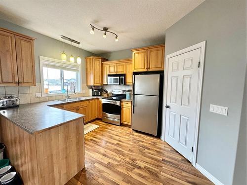 12-9 Leedy Drive, Whitecourt, AB - Indoor Photo Showing Kitchen With Stainless Steel Kitchen With Double Sink