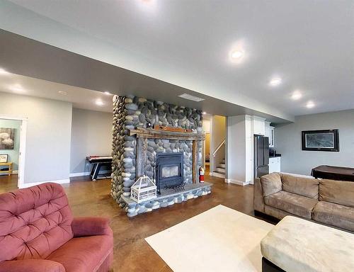 52415A Range Road 180, Rural Yellowhead County, AB - Indoor Photo Showing Living Room With Fireplace