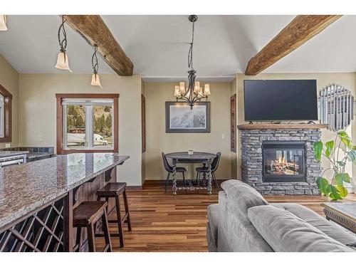 4-134 15 Street, Canmore, AB - Indoor With Fireplace