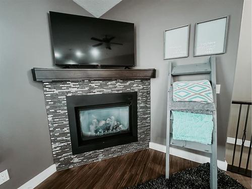 18 Ridgeway Point, Whitecourt, AB - Indoor Photo Showing Living Room With Fireplace