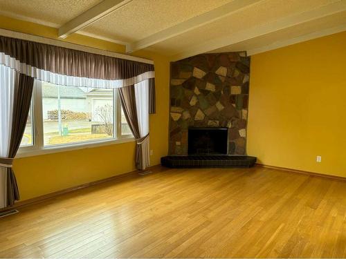 11 Stiles Cove, Whitecourt, AB - Indoor Photo Showing Living Room With Fireplace