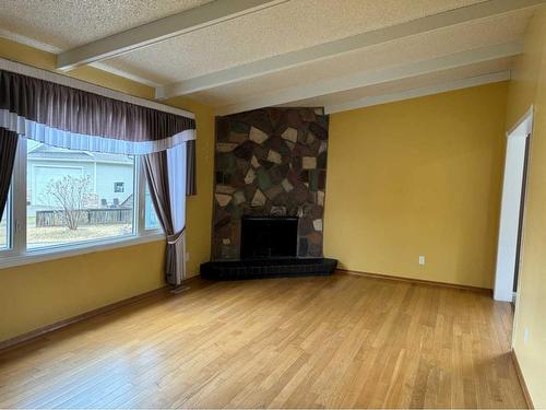 11 Stiles Cove, Whitecourt, AB - Indoor Photo Showing Living Room With Fireplace