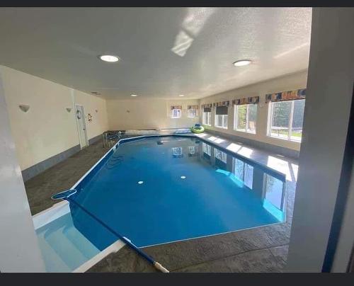 29 594028 Range Road 125, Rural Woodlands County, AB - Indoor Photo Showing Other Room With In Ground Pool