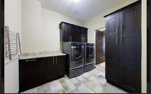 29 594028 Range Road 125, Rural Woodlands County, AB - Indoor Photo Showing Laundry Room