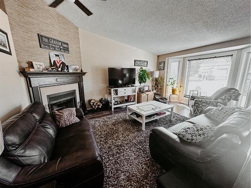 10 Park Drive, Whitecourt, AB - Indoor Photo Showing Living Room With Fireplace