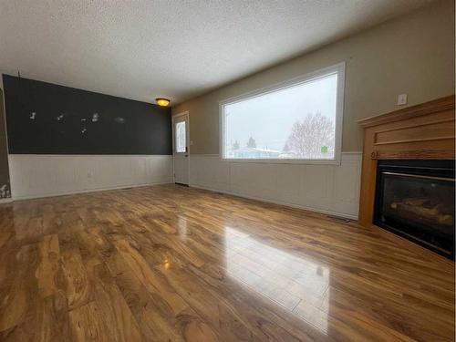 16 Centenial Crescent, Swan Hills, AB - Indoor Photo Showing Living Room With Fireplace