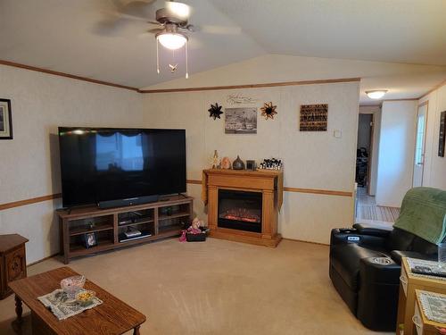 207 4A Street, Fox Creek, AB - Indoor Photo Showing Living Room With Fireplace