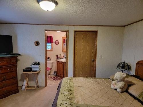 207 4A Street, Fox Creek, AB - Indoor Photo Showing Bedroom