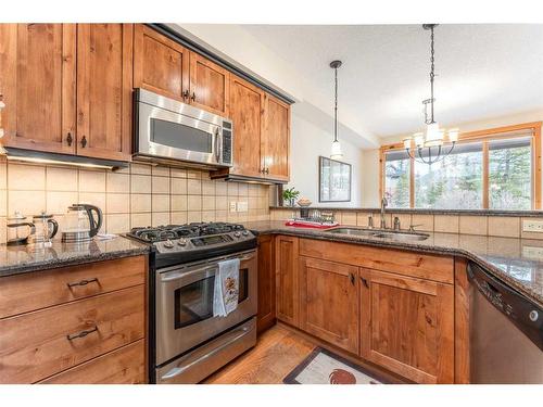 215-107 Armstrong Place, Canmore, AB - Indoor Photo Showing Kitchen With Stainless Steel Kitchen With Double Sink