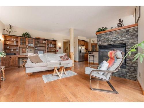 215-107 Armstrong Place, Canmore, AB - Indoor Photo Showing Living Room With Fireplace