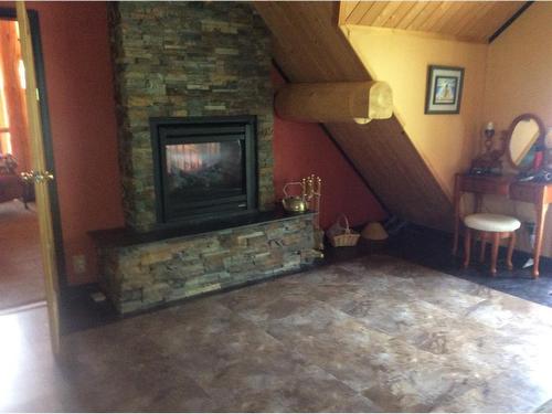 26 124062 Township Road 593A, Rural Woodlands County, AB - Indoor Photo Showing Other Room With Fireplace