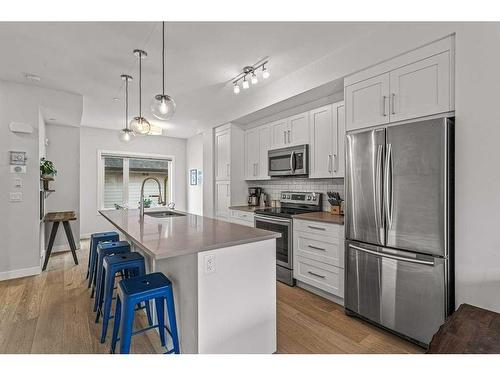 106-1106 Bow Valley Trail, Canmore, AB - Indoor Photo Showing Kitchen With Upgraded Kitchen
