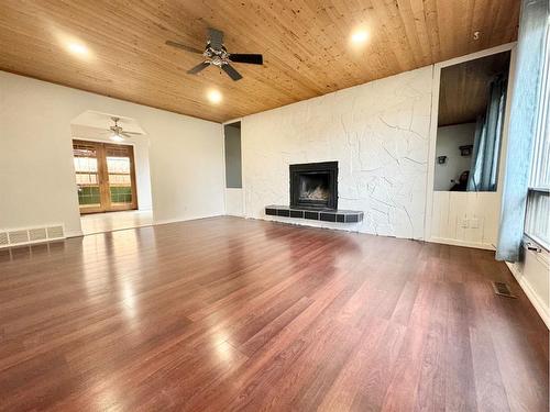 51 Harolds Hollow, Whitecourt, AB - Indoor Photo Showing Living Room With Fireplace