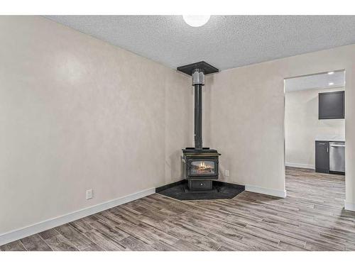 B-419 Marten Street, Banff, AB - Indoor With Fireplace