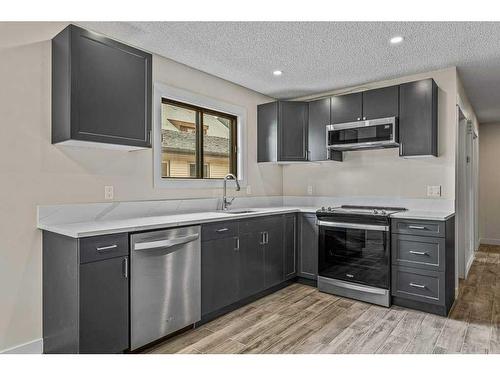 B-419 Marten Street, Banff, AB - Indoor Photo Showing Kitchen With Double Sink With Upgraded Kitchen