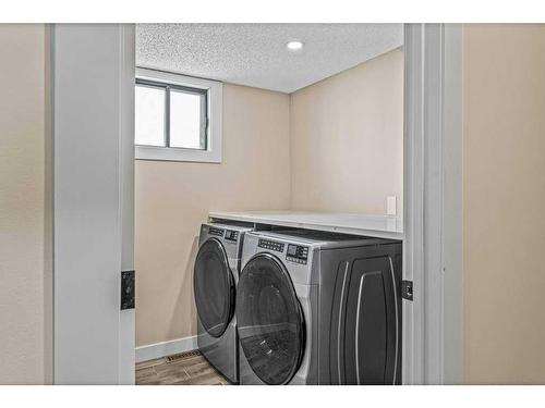 B-419 Marten Street, Banff, AB - Indoor Photo Showing Laundry Room