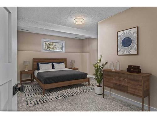 B-419 Marten Street, Banff, AB - Indoor Photo Showing Bedroom