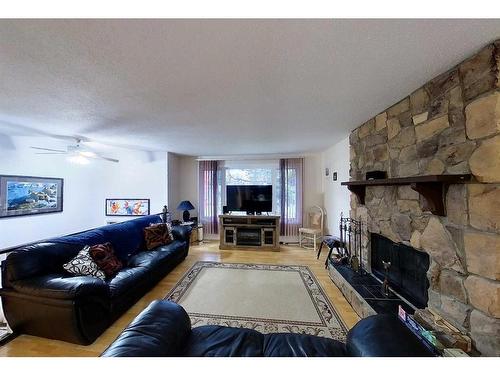 5908 9 Avenue, Edson, AB - Indoor Photo Showing Living Room With Fireplace