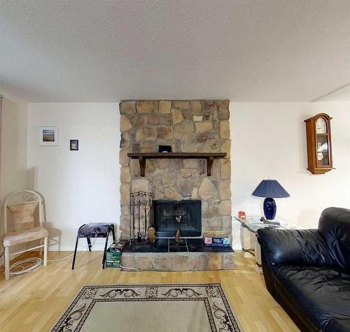 5908 9 Avenue, Edson, AB - Indoor Photo Showing Living Room With Fireplace