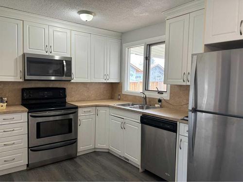 23 Sandy Drive, Whitecourt, AB - Indoor Photo Showing Kitchen With Double Sink