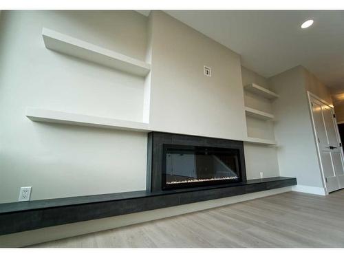 64 Pritchard Drive, Whitecourt, AB - Indoor Photo Showing Living Room With Fireplace