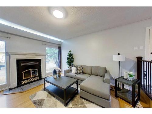 901 13 Avenue Se, Slave Lake, AB - Indoor Photo Showing Living Room With Fireplace