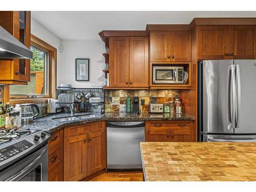 108-702 4Th Street, Canmore, AB - Indoor Photo Showing Kitchen With Double Sink