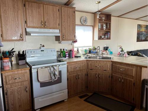 407 9 Street, Fox Creek, AB - Indoor Photo Showing Kitchen With Double Sink