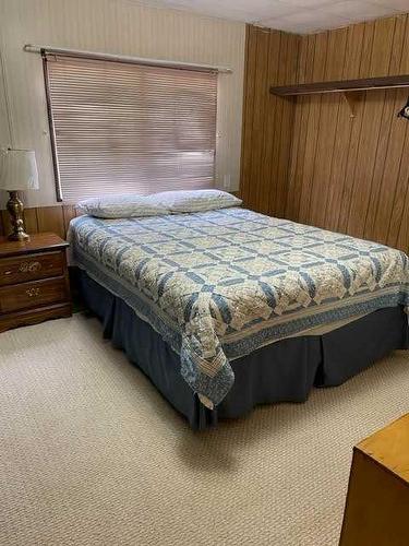 209 4 St, Fox Creek, AB - Indoor Photo Showing Bedroom