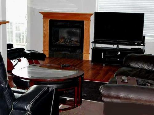 103-501 3 Street Ne, Fox Creek, AB - Indoor Photo Showing Living Room With Fireplace
