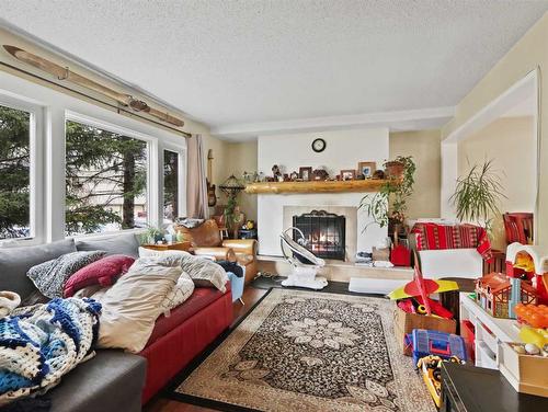 1621 1St Avenue, Canmore, AB - Indoor Photo Showing Living Room With Fireplace