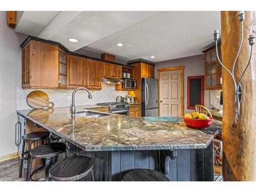 104 Silvertip Ridge, Canmore, AB - Indoor Photo Showing Kitchen With Double Sink With Upgraded Kitchen