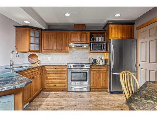 104 Silvertip Ridge, Canmore, AB - Indoor Photo Showing Kitchen With Stainless Steel Kitchen