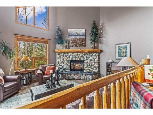 104 Silvertip Ridge, Canmore, AB - Indoor Photo Showing Living Room With Fireplace