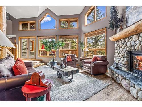 104 Silvertip Ridge, Canmore, AB - Indoor Photo Showing Living Room With Fireplace