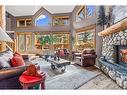 104 Silvertip Ridge, Canmore, AB  - Indoor Photo Showing Living Room With Fireplace 