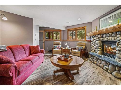 104 Silvertip Ridge, Canmore, AB - Indoor Photo Showing Living Room With Fireplace