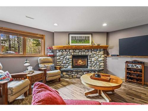 104 Silvertip Ridge, Canmore, AB - Indoor Photo Showing Living Room With Fireplace