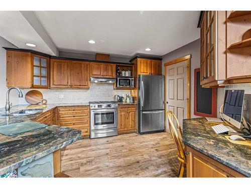 104 Silvertip Ridge, Canmore, AB - Indoor Photo Showing Kitchen With Stainless Steel Kitchen With Double Sink