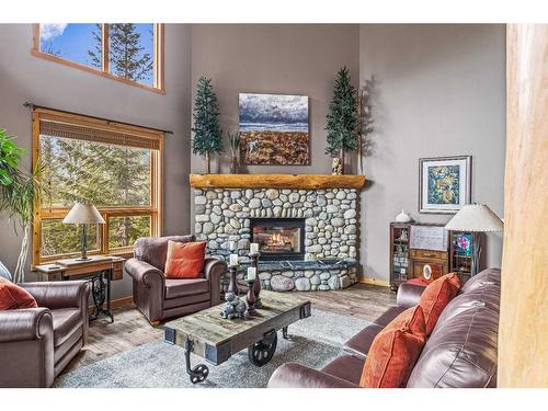 104 Silvertip Ridge, Canmore, AB - Indoor Photo Showing Living Room With Fireplace